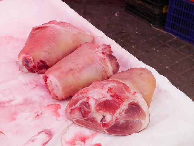 Pork knuckles displayed in a butcher shop